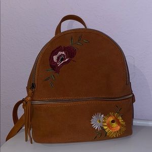 brown mini backpack with flowers